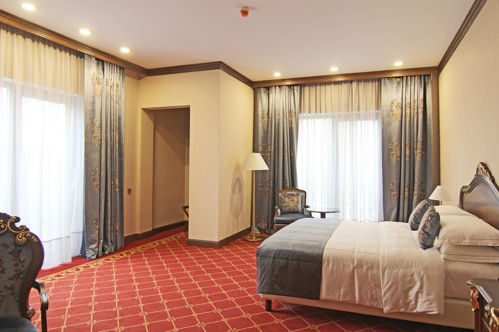 Orion Hotel Bishkek Exterior photo A bedroom at the hotel