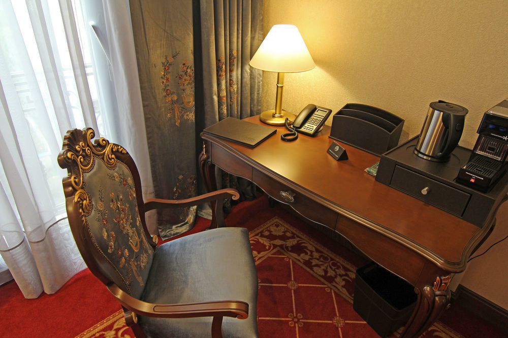 Orion Hotel Bishkek Exterior photo A writing desk in a hotel room
