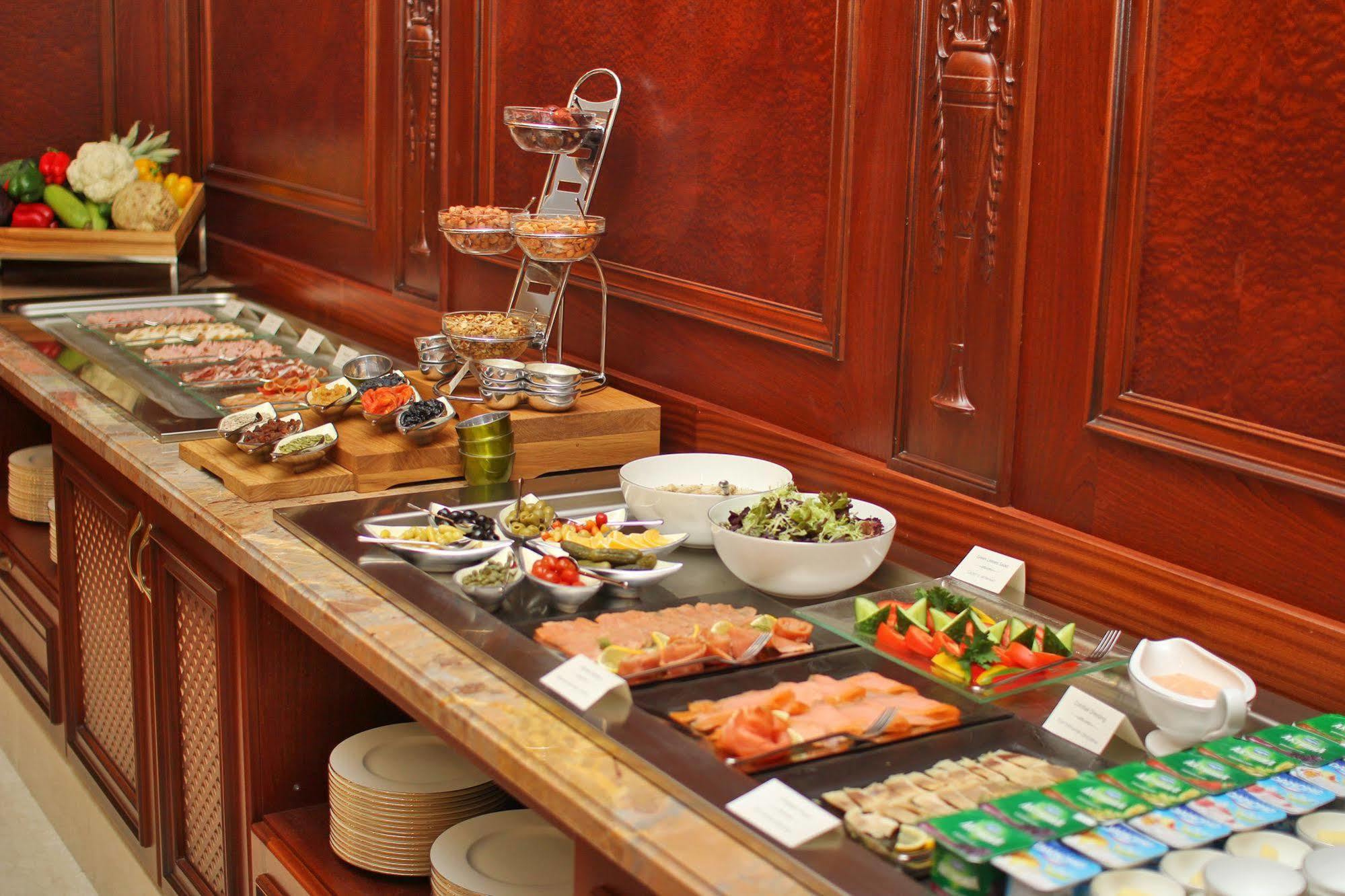 Orion Hotel Bishkek Exterior photo A buffet at a hotel